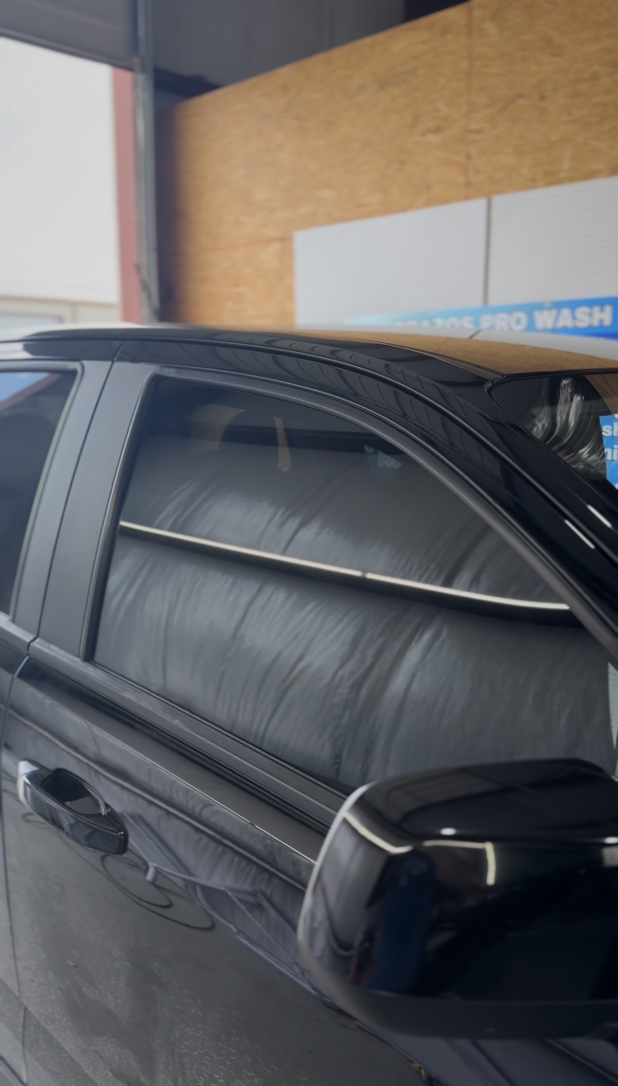 Tinted rear window of a truck after installation
