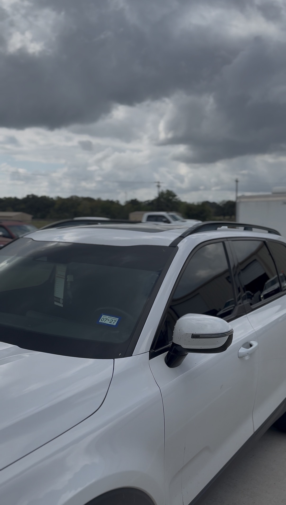 White Ford SUV with tinted windows