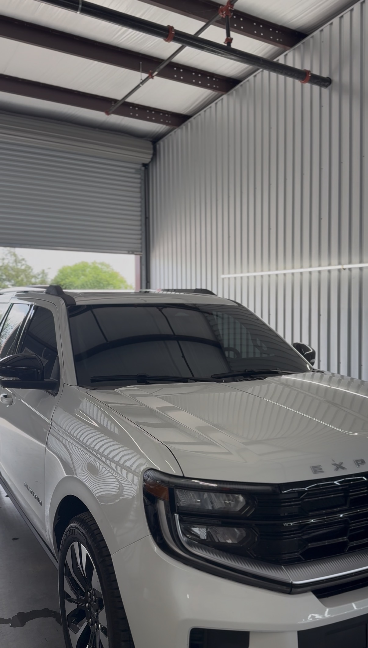 White GMC Yukon with tinted windows