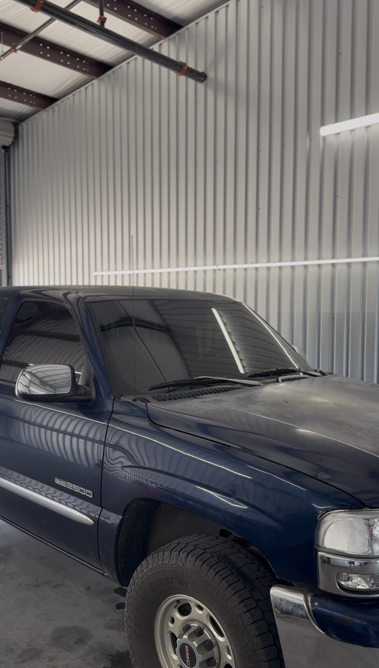 Navy blue Chevrolet Silverado with tinted windows