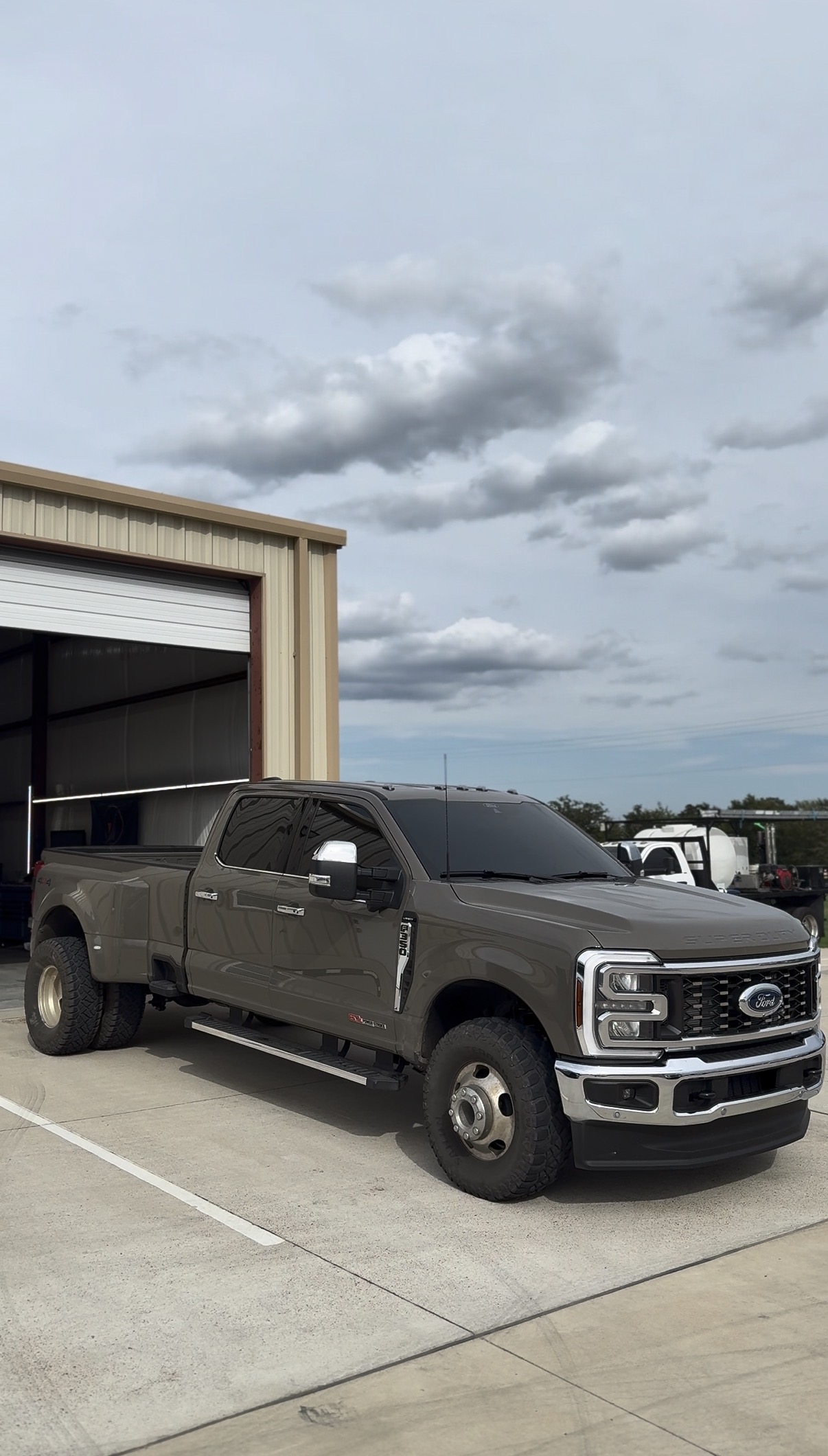 Gray Ford F-350 dually with tinted windows